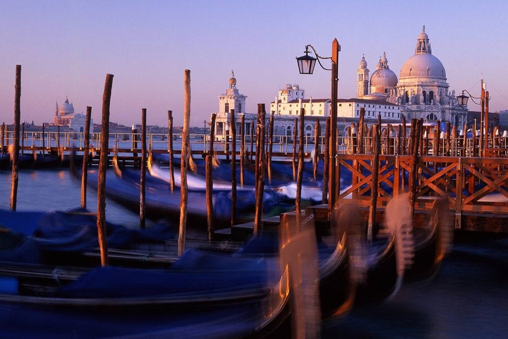 Image of Santa Maria della Salute and gondolas at sunrise, Venice Italy