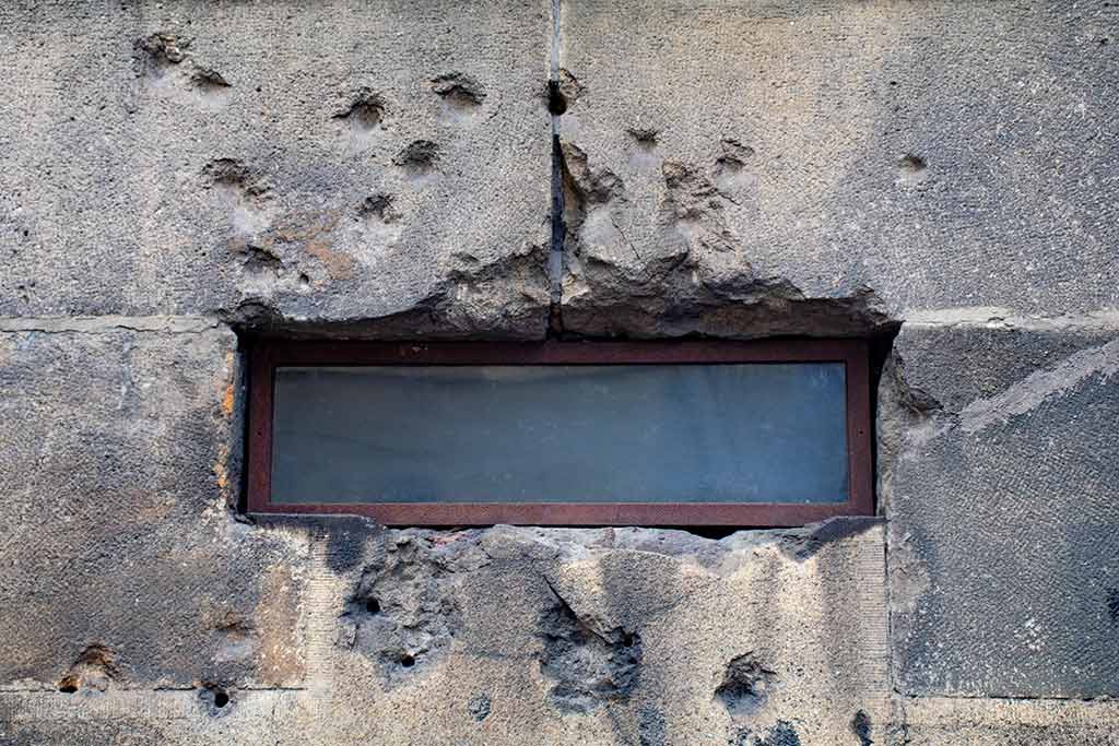 Image of bulletholes on the wall of SS Cyril and Methodius cathedral Pragueof 