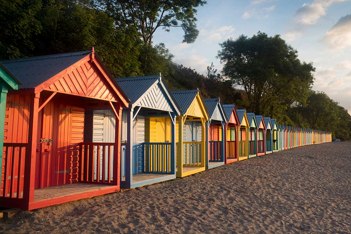 image of beach huts in llanbedrog llyn peninsula gwynedd north Wales uk