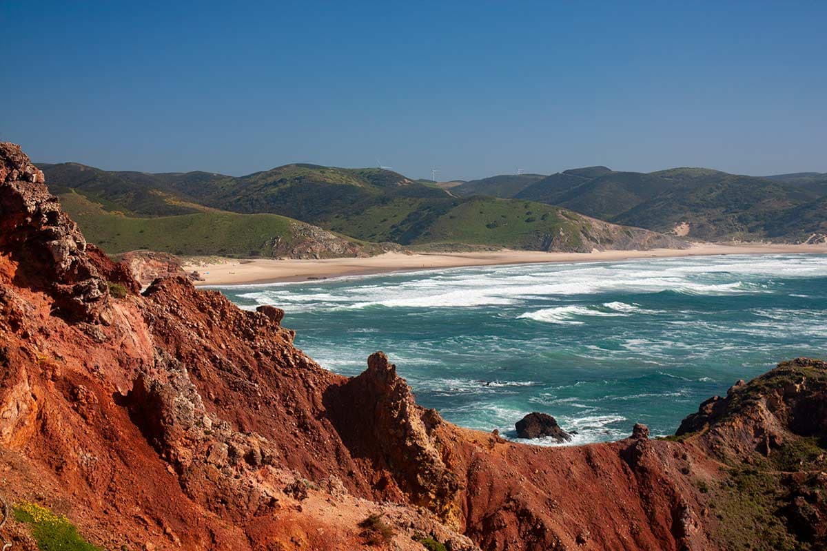 image of praia do amado beach and ochre cliffs carrapateira algarve portugal