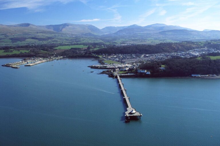 things to do in bangor wales image of bangor pier, city and mountains of snowdonia north wales uk