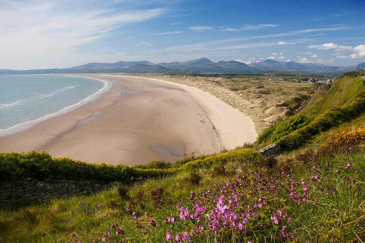 image of Harlech beach and snowdonia gwynedd north Wales uk