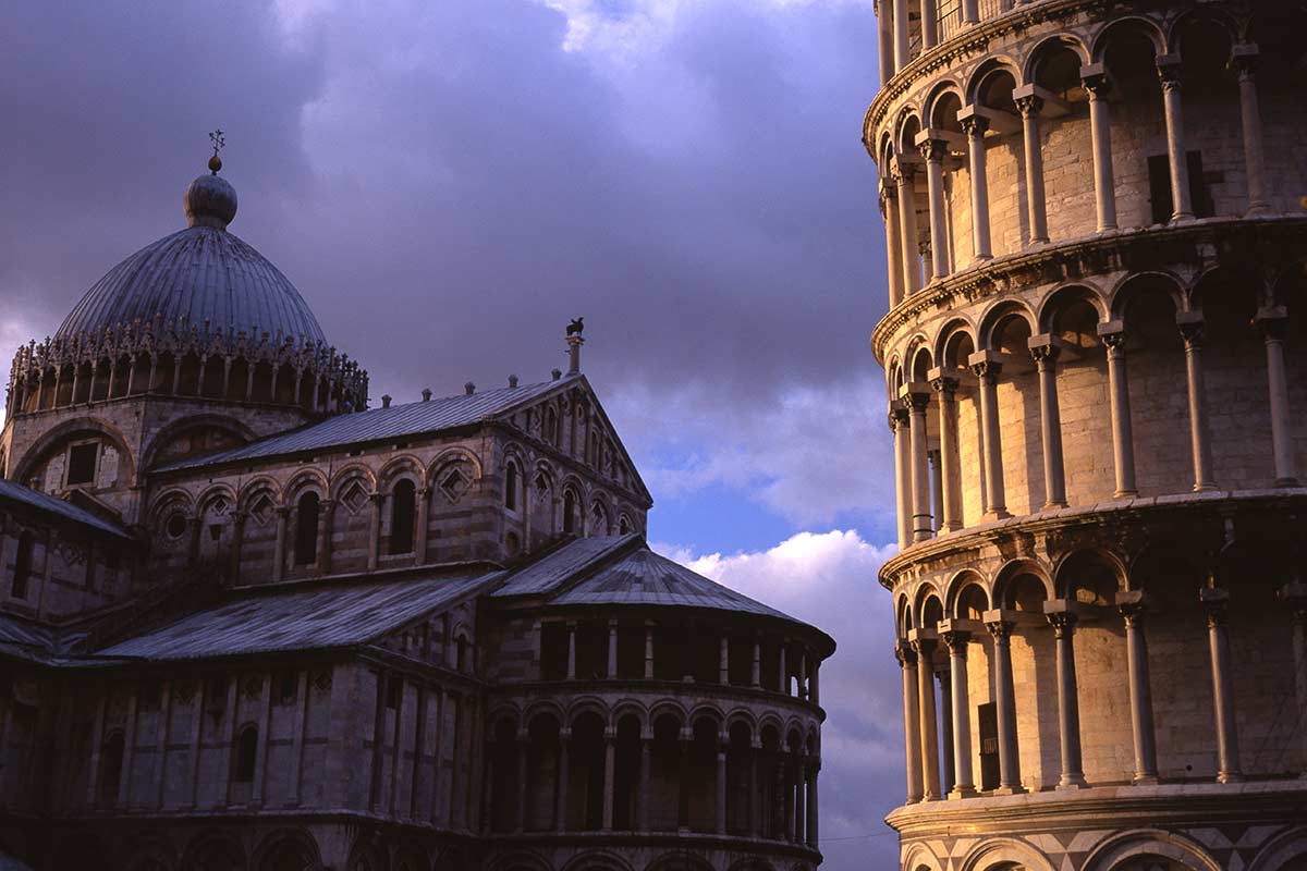 image of leaning tower and duomo of Pisa at sunset Tuscany italy