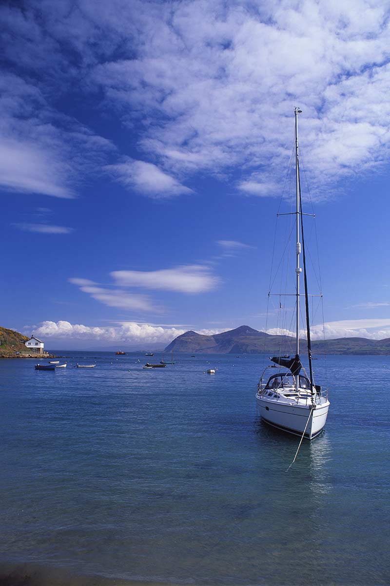 image of boat moored in harbour at Porthdinllaen gwynedd north Wales uk