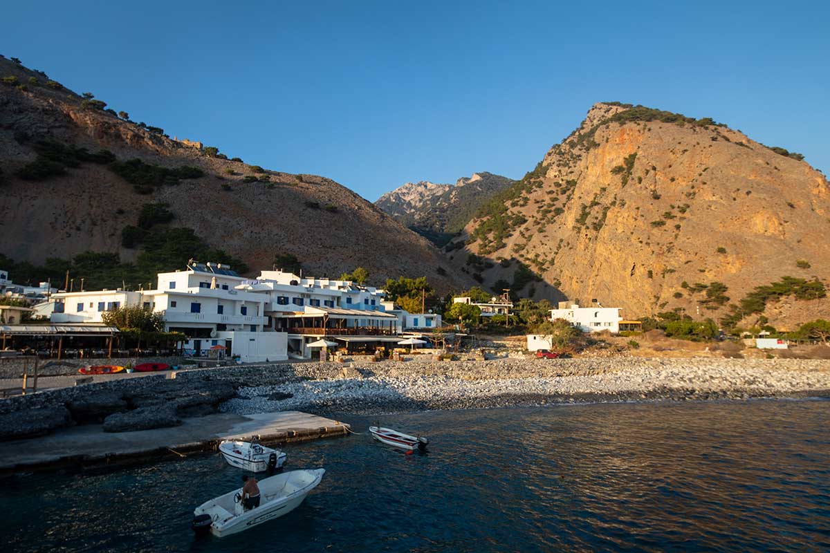 image of Agia Roumeli village from ferry at sunset crete greece