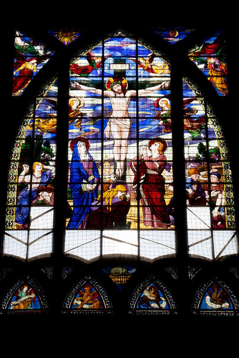 image of art nouveau stained glass window above altar in st jean de Montmartre church Paris france