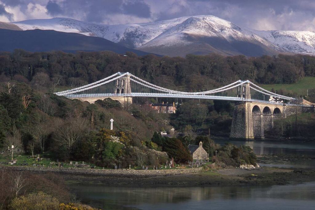 image of st Tysilio's church below Menai suspension bridge Menai Bridge anglesey north Wales uk