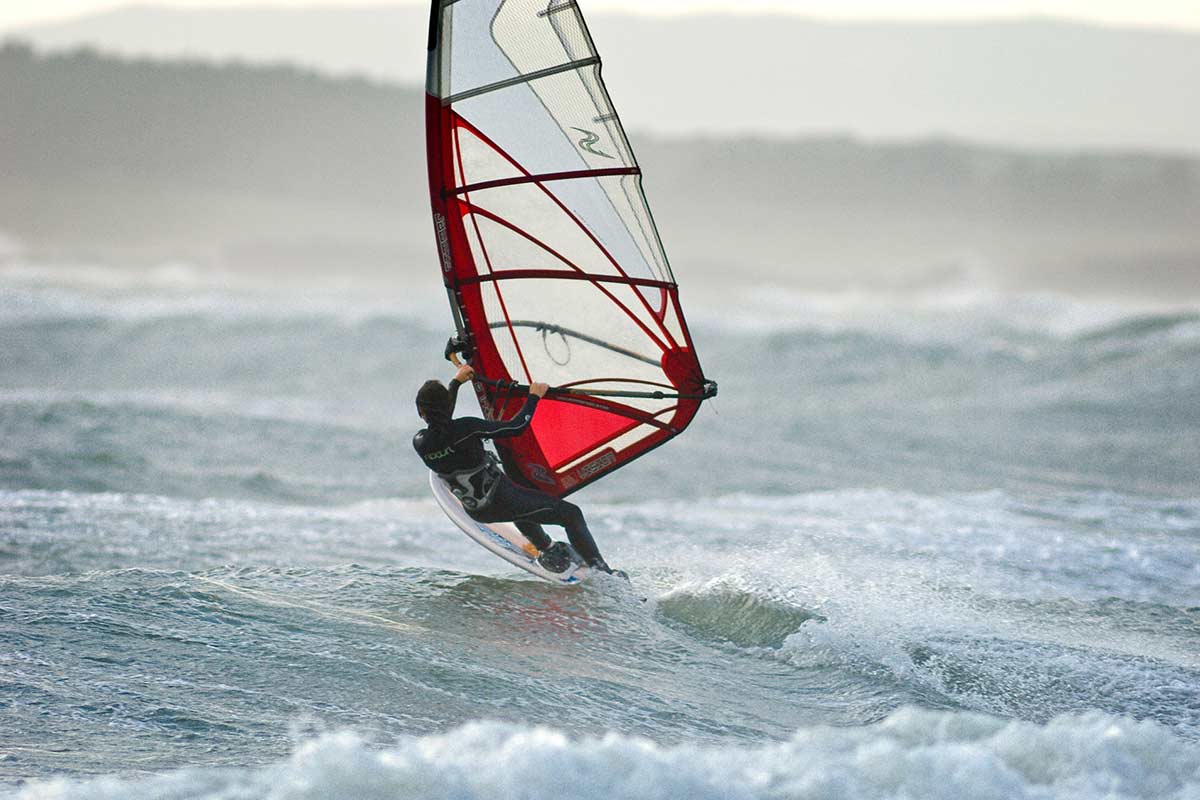image of windsurfer at rhosneigr anglesey north Wales uk