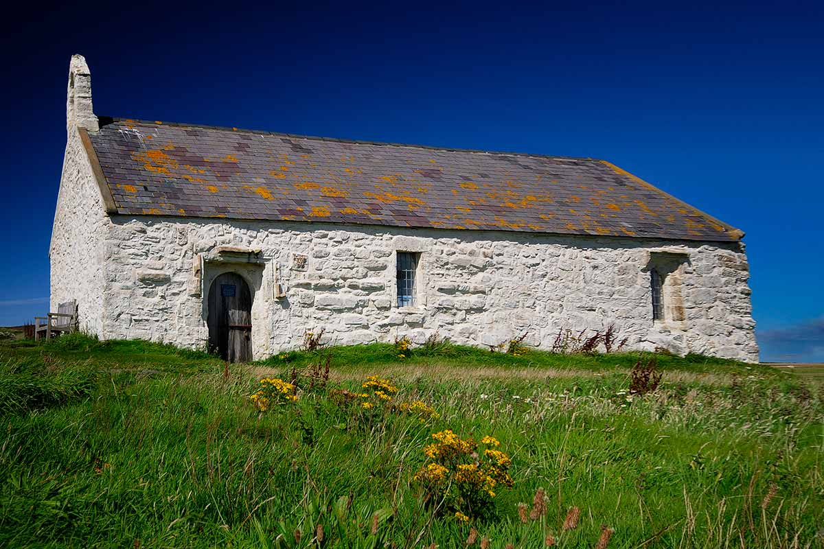 image of st Cwyfan's church aberffraw anglesey north Wales uk