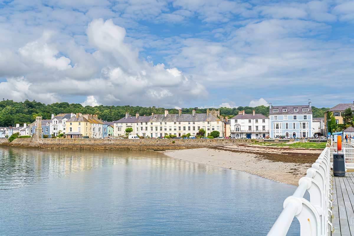 image of pebble beach and seafront beaumaris anglesey north Wales uk