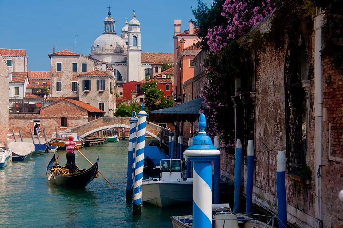 image of canal pole markers on a canal in dorsoduro venice italy