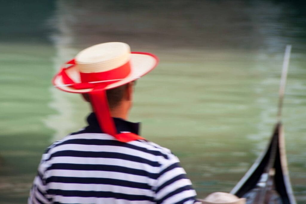 image of gondolier on canal venice italy
