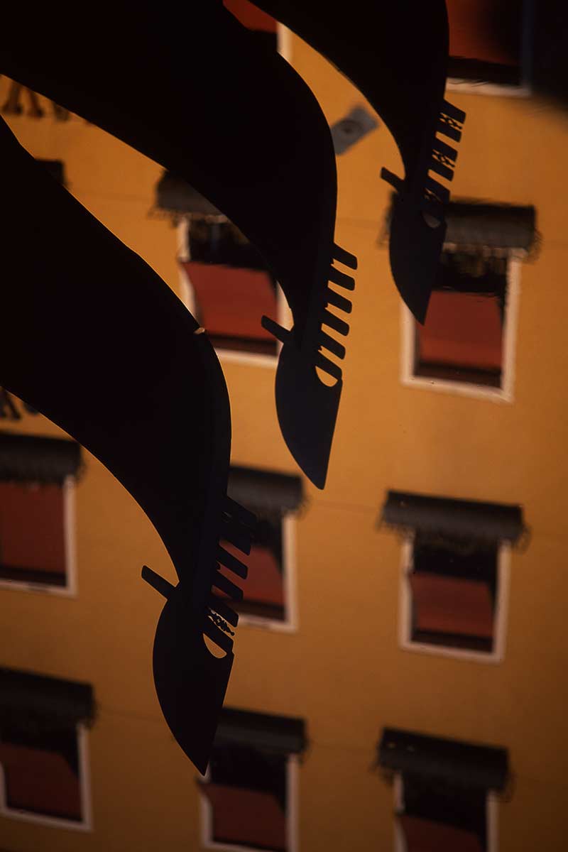 image of gondolas reflected in the bacino orseolo venice italy