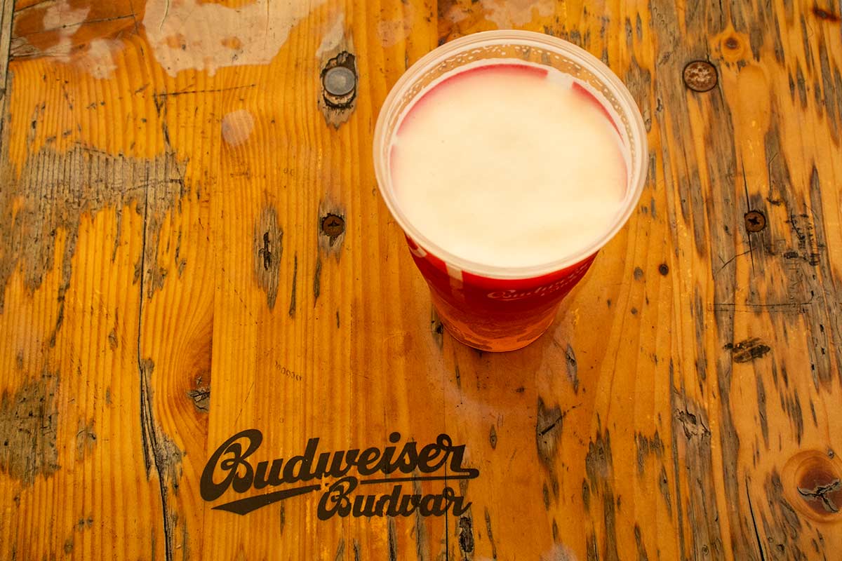 image of glass of budvar beer on a wooden table in the Czech republic