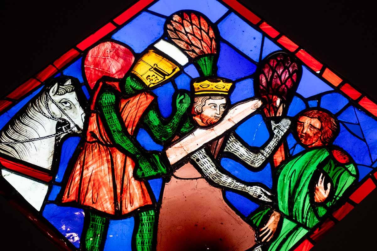 image of stained glass panel showing a knight killing a king at Cluny museum Paris France