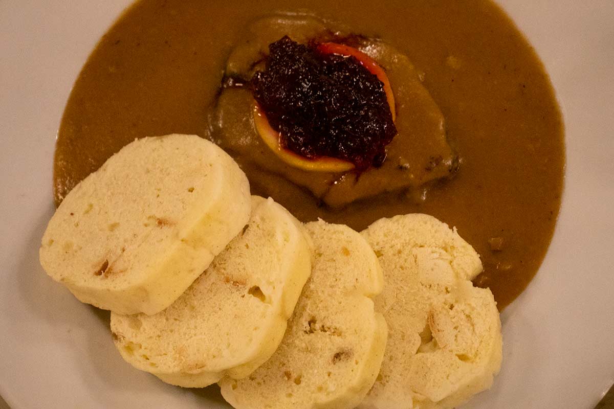 image of plate of svickova na smetane in a restaurant in Prague czech republic