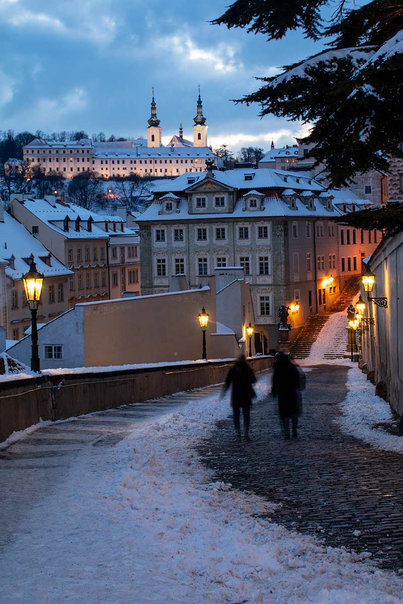 image of snowy street in prague at dusk czech republic