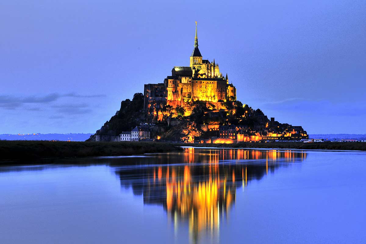 image of mont-saint-michel at dusk normandy france