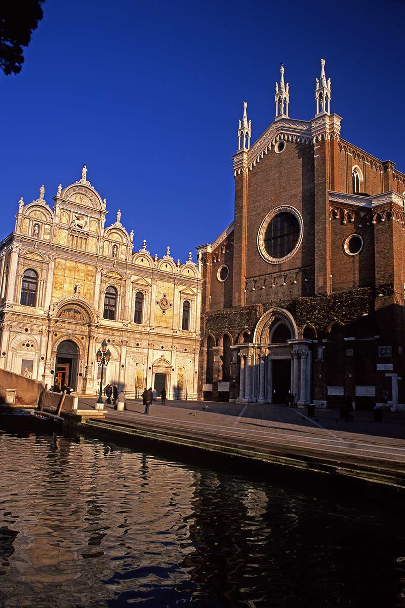 image of ss giovanni & Paolo church and former scuola grande di San Marco from rio dei mendicanti canal venice italy