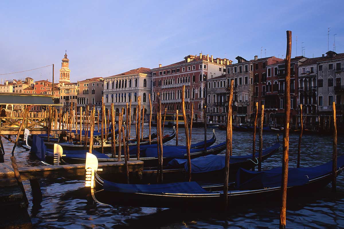 image of gondolas on grand canal near Rialto bridge venice italy