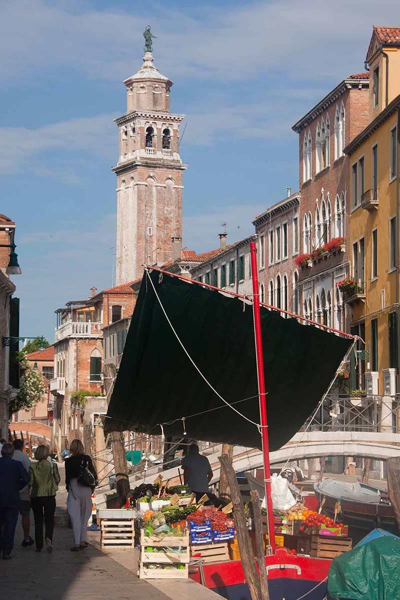 image of greengrocer boat on rio di san Barnaba canal venice italy