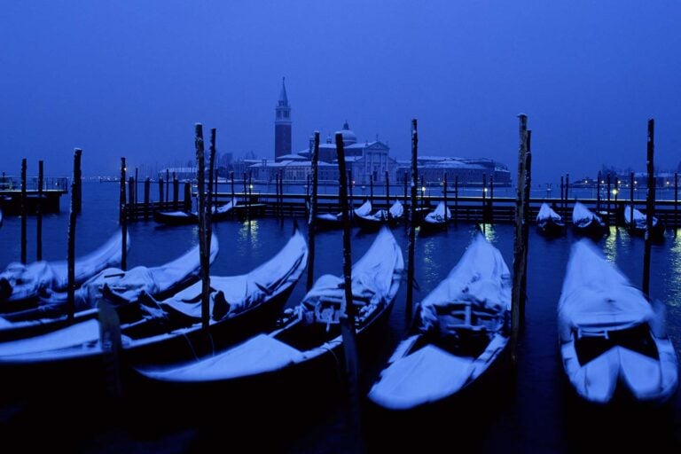 venice in winter image of gondolas and san Giorgio maggiore church in snow venice veneto italy