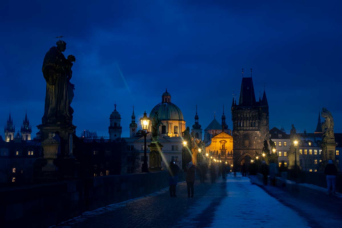 image of Charles Bridge and old town in snow prague czech republic