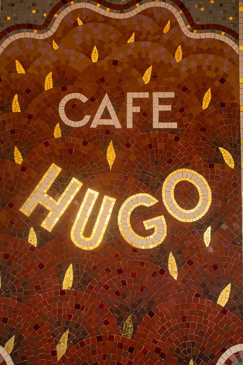 image of cafe Hugo sign place des vosges Paris france