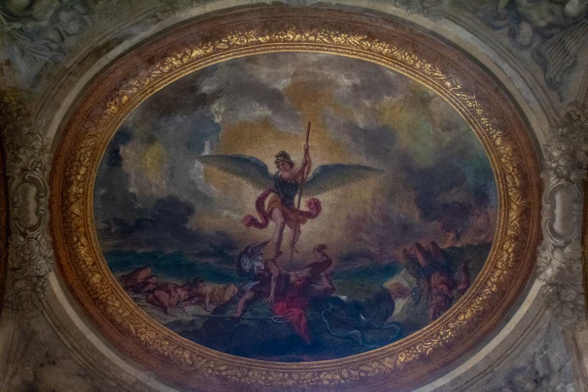 image of Delacroix's ceiling painting of St Michael vanquishing the devil in st Sulpice church Paris france
