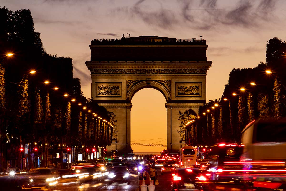 image of arc de triumph at sunset Paris france
