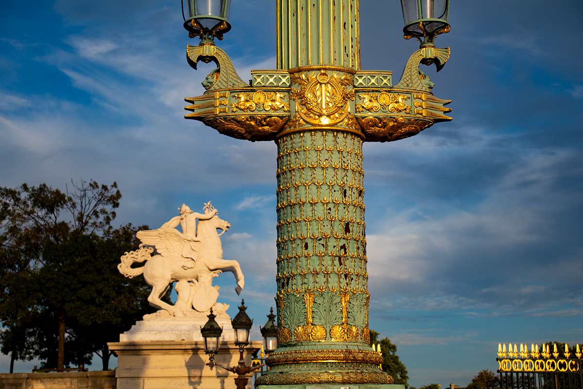 image of ;lamp post and statue on place de la Concorde Paris france