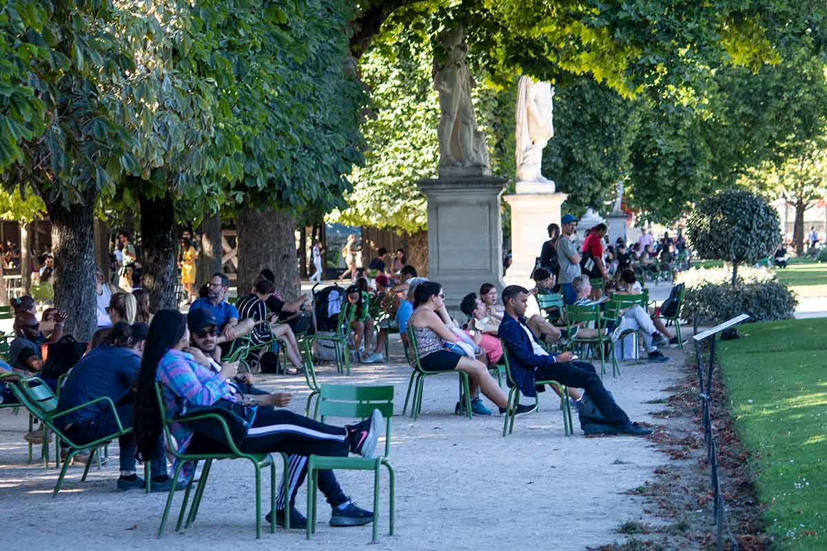 image off people sitting and relaxing in the Tuileries garden Paris france