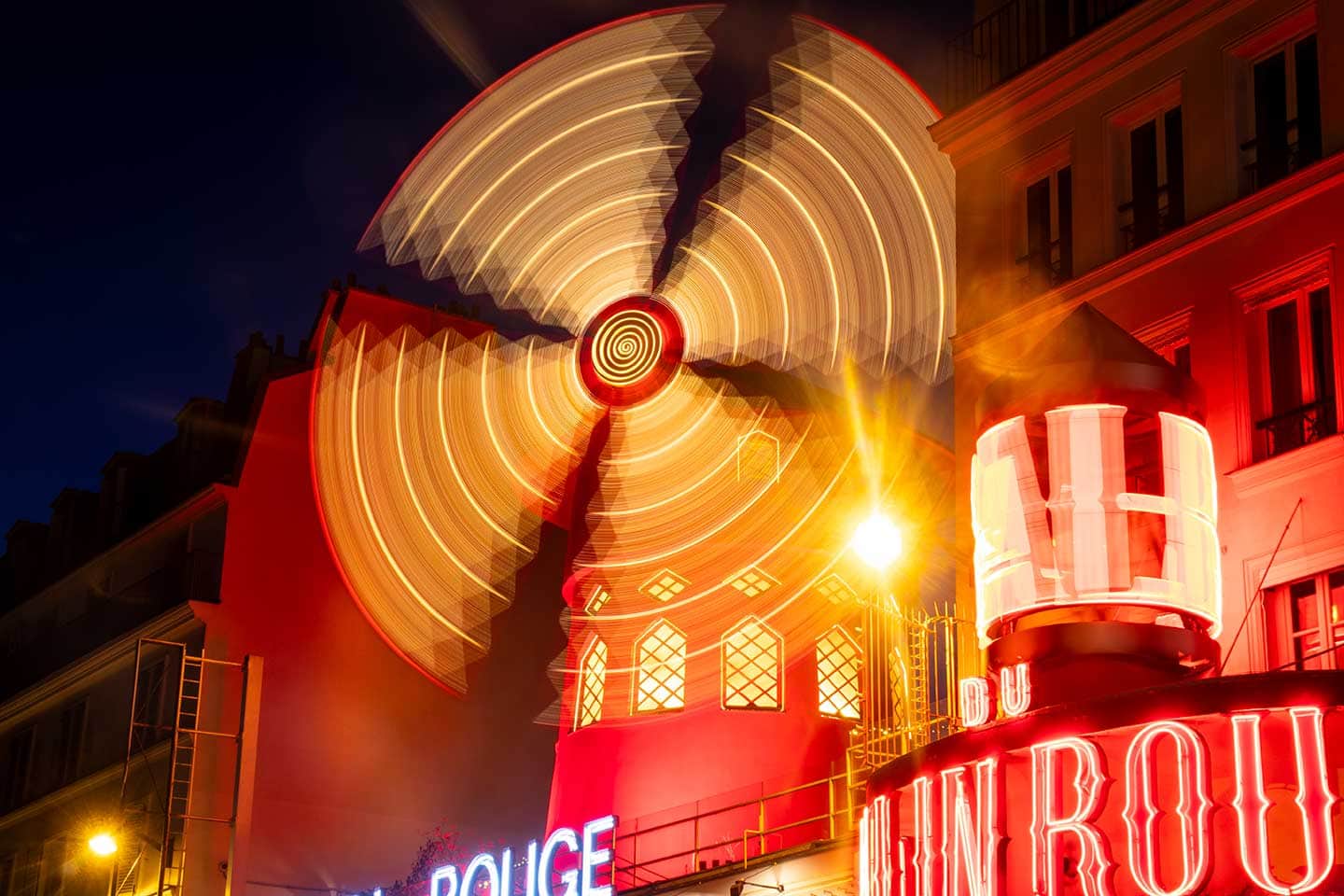 icons of Paris image ion the moulin rouge at night Paris france