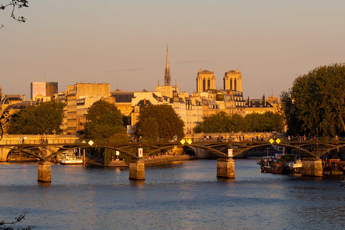 image of river seine looking towards pont des arts and Notre dame Paris france