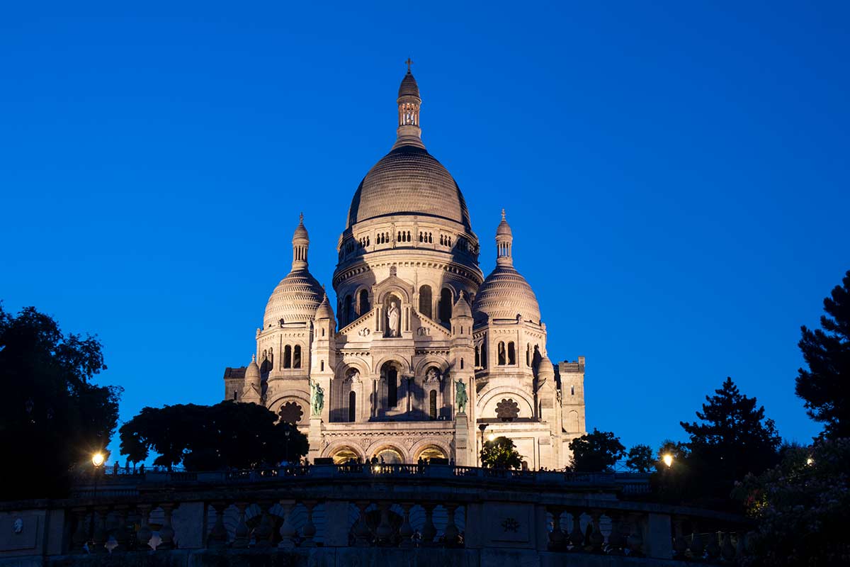image of Sacré coeur basilica at dusk Montmartre Paris france