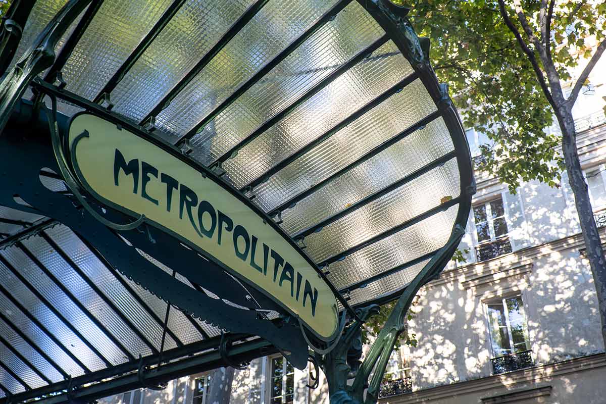 image of detail of butterfly-style canopy at entrance to abbesses metro station Paris france