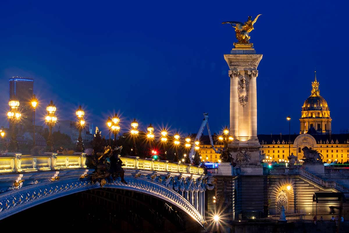 imagen of pont Alexandre iii and hotel des invalides at dusk Paris france