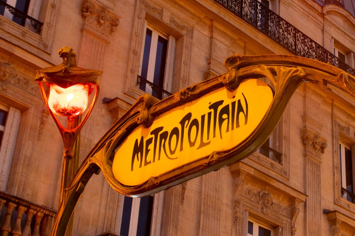 image of art nouveau metro sign in Paris at dusk Paris france