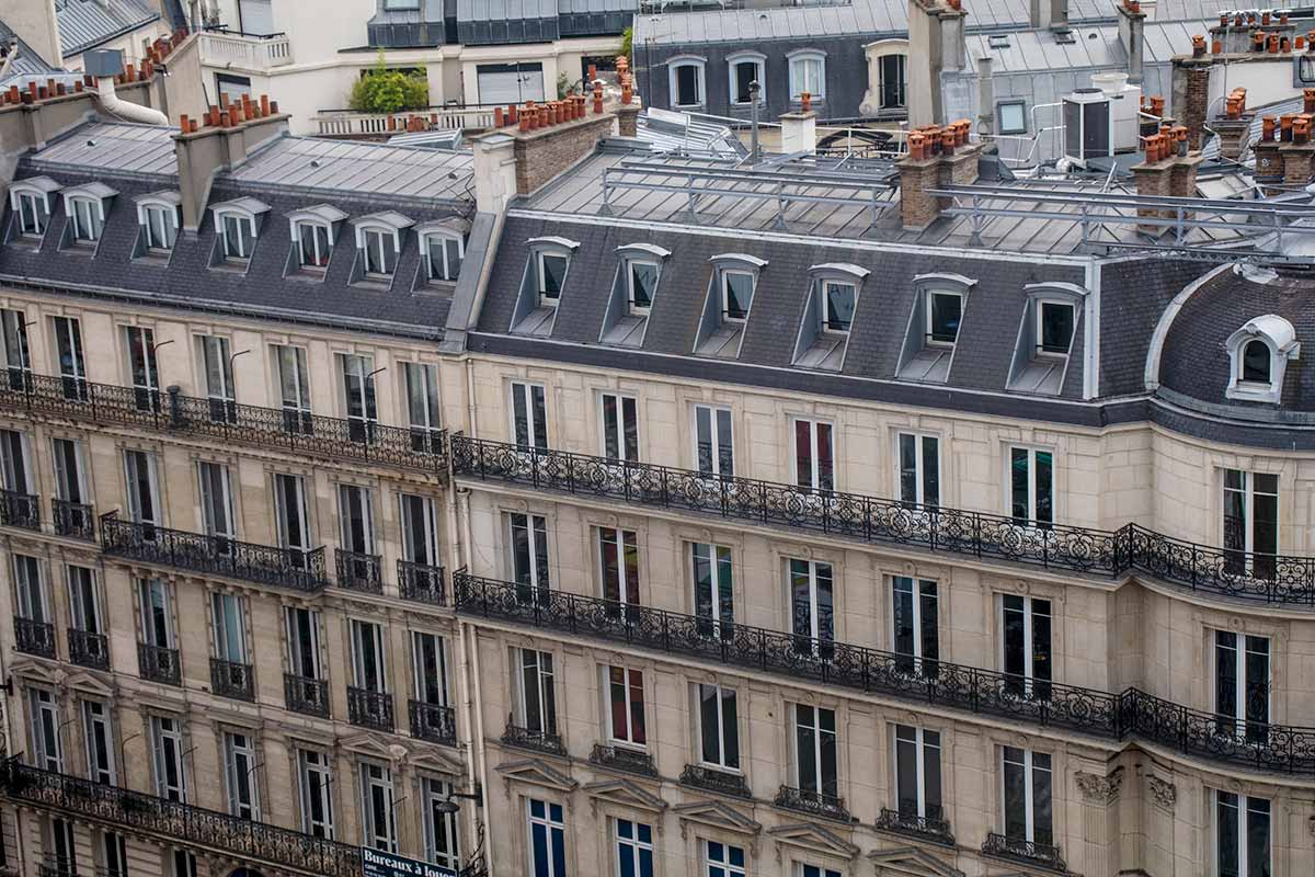 image of Parisian apartment buildings on boulevard Haussmann Paris france