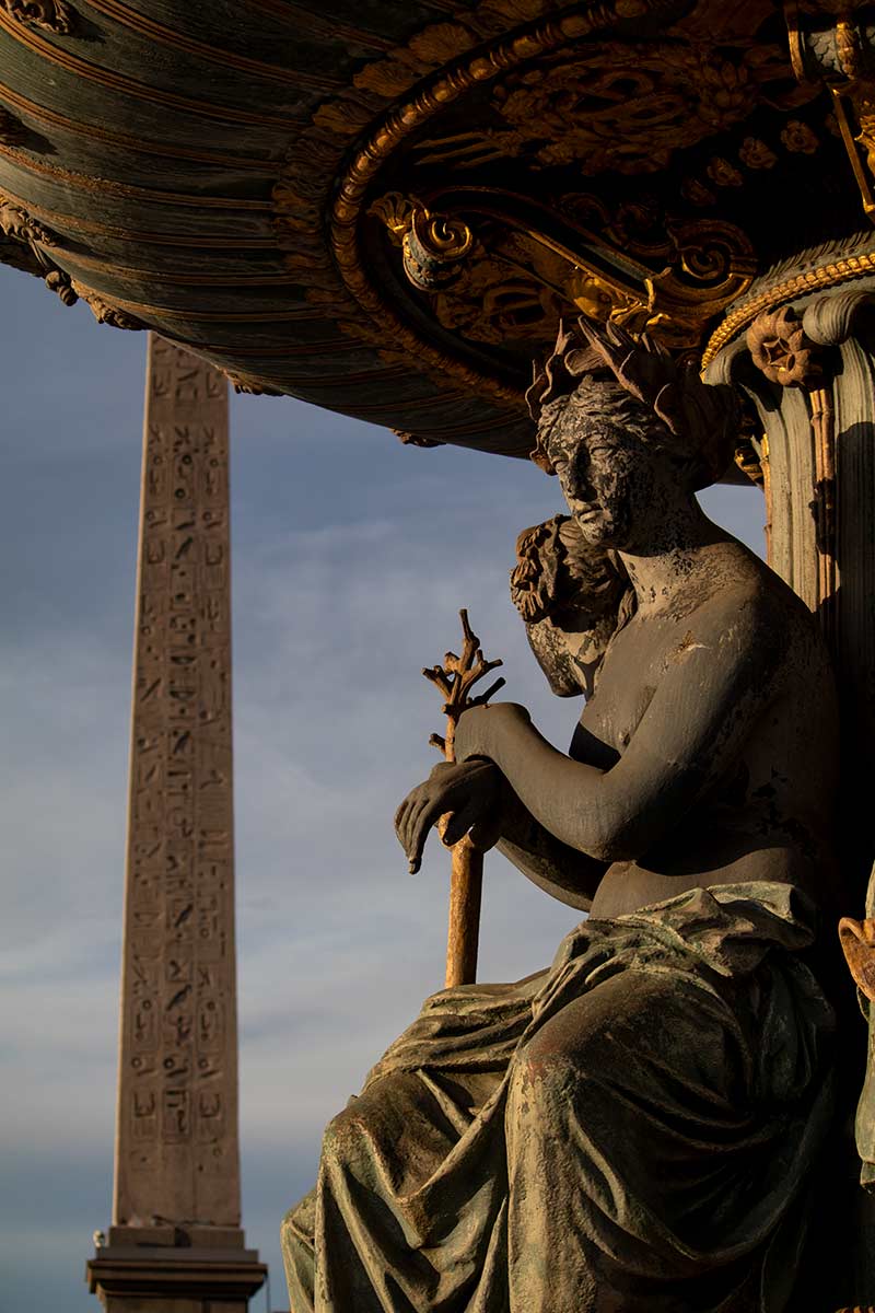 image of figure in the Fontaine des mere and Luxor obelisk place de la Concorde Paris france