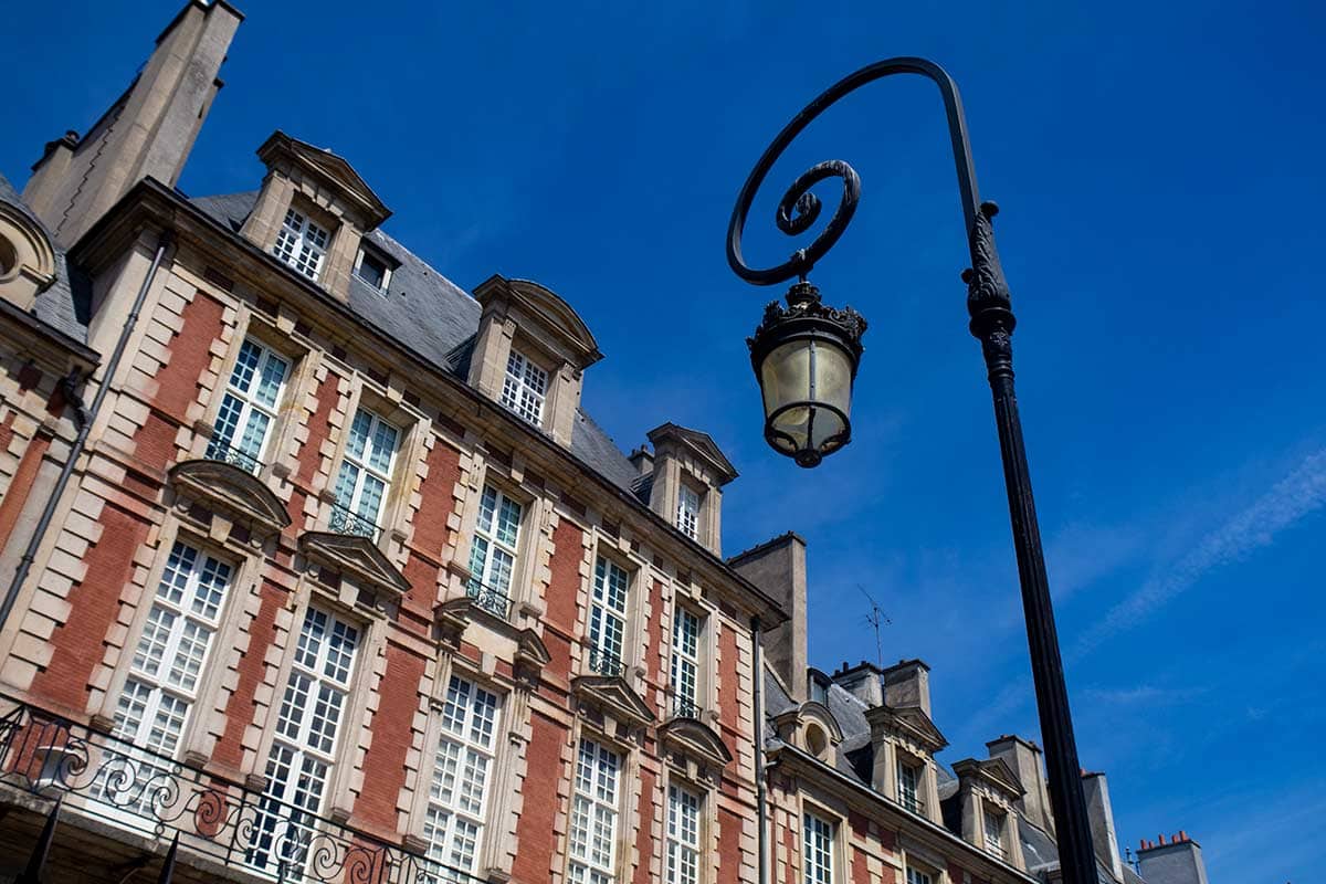 image of houses on place des vosges Paris france