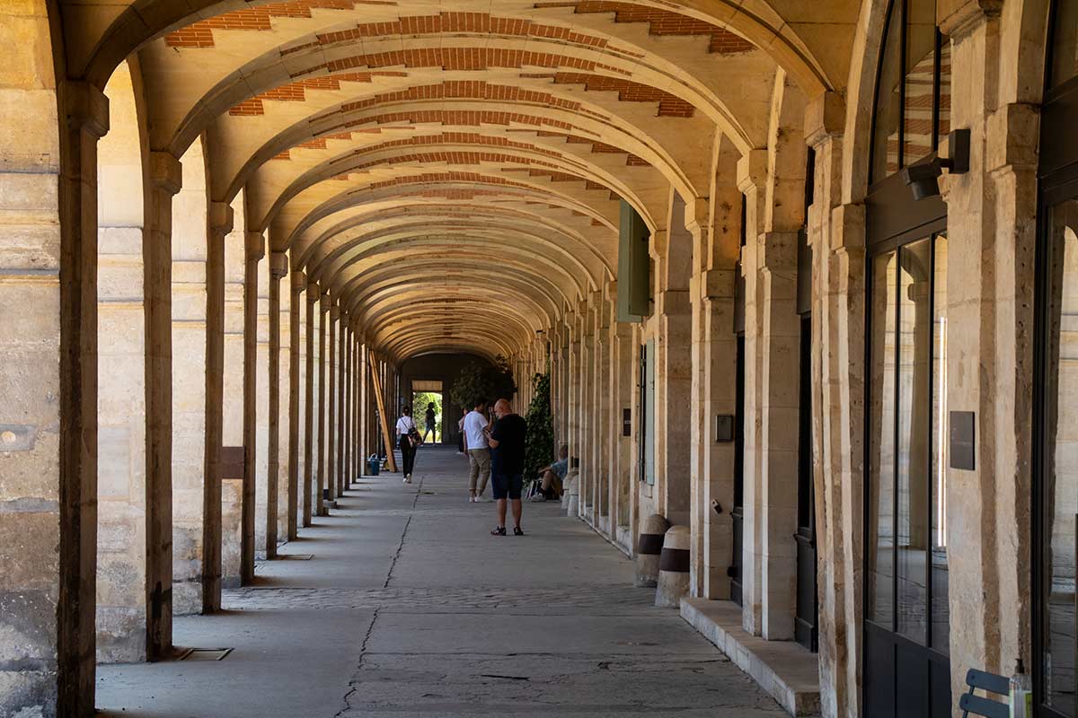 image of arcade in place des vosges Paris france