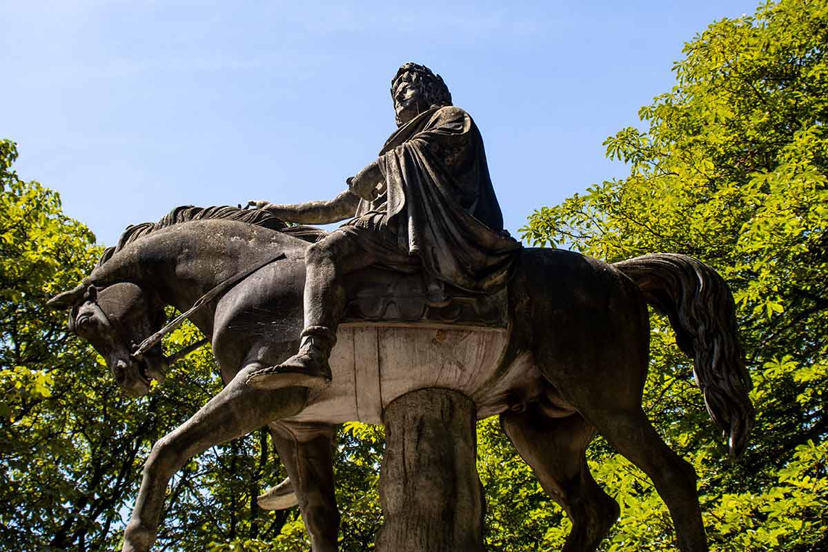 image of side view of statue of Louis xiii in place des vosges Paris france