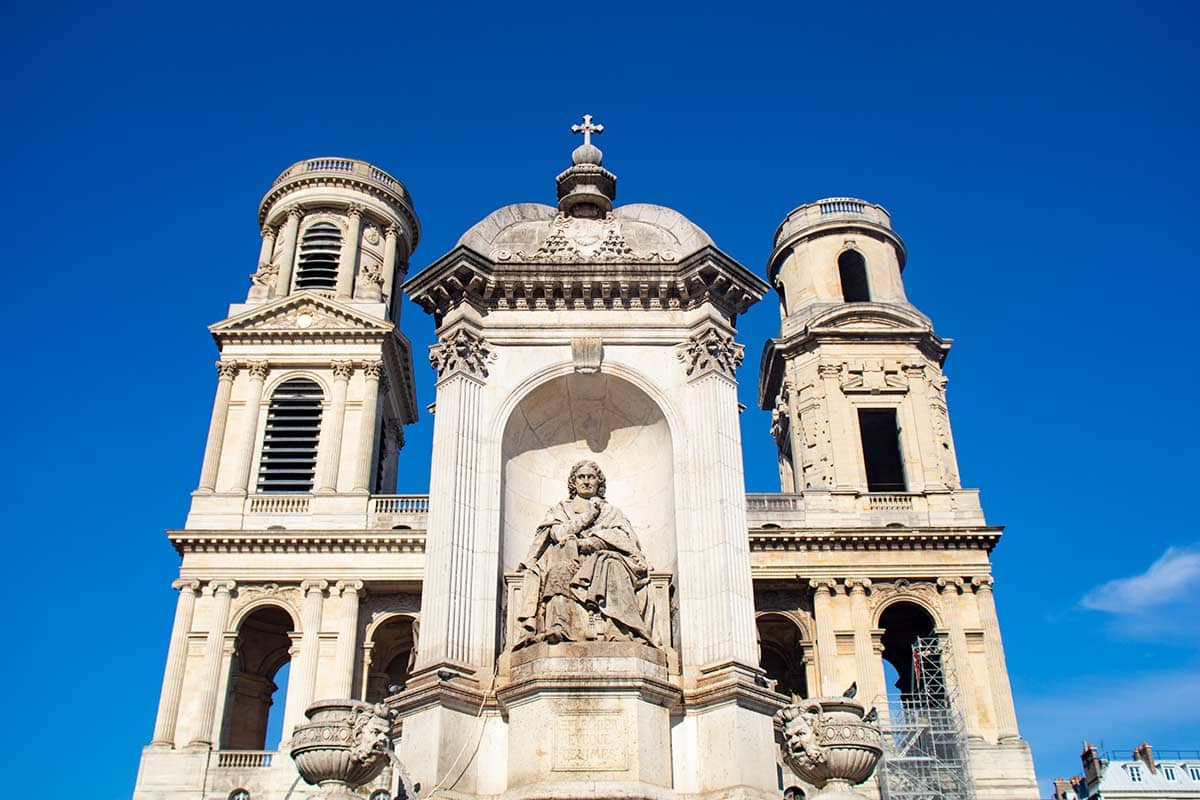 image of towers of st Sulpice church and fountain in foreground latin quarter Paris france