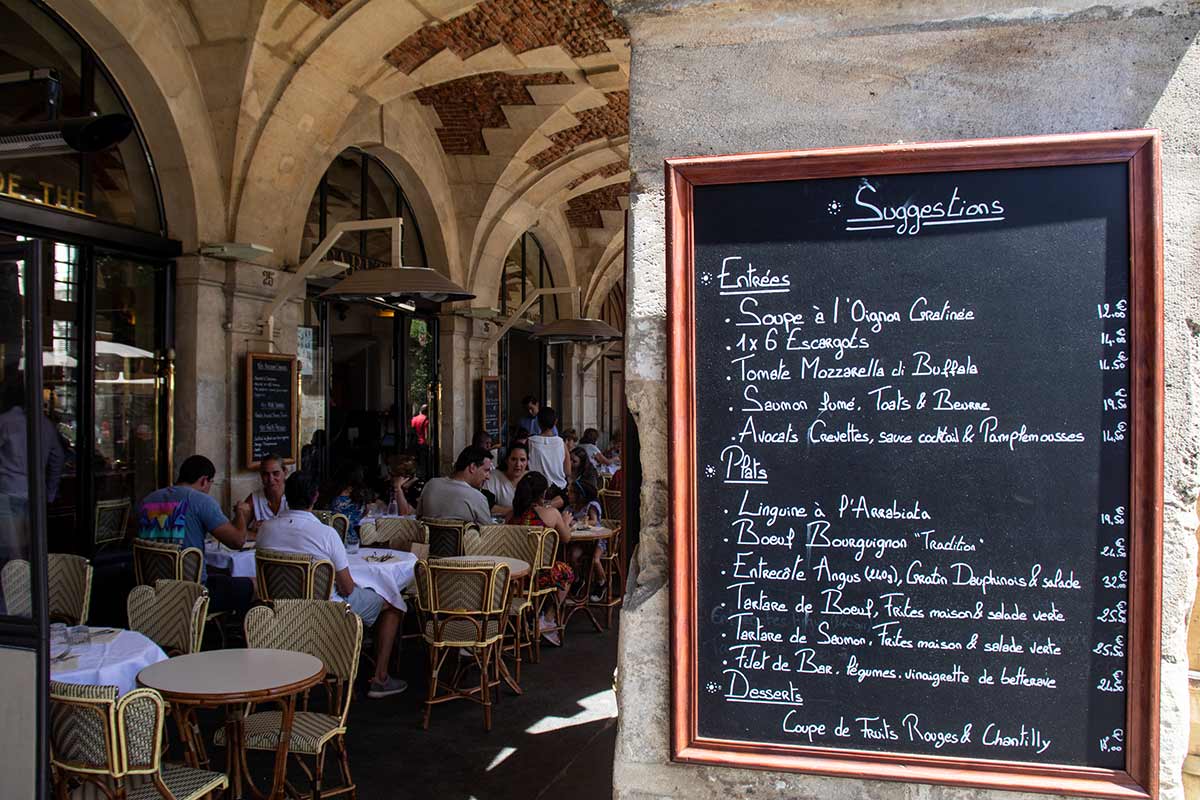 image of cafe in place des vosges arcade Paris france