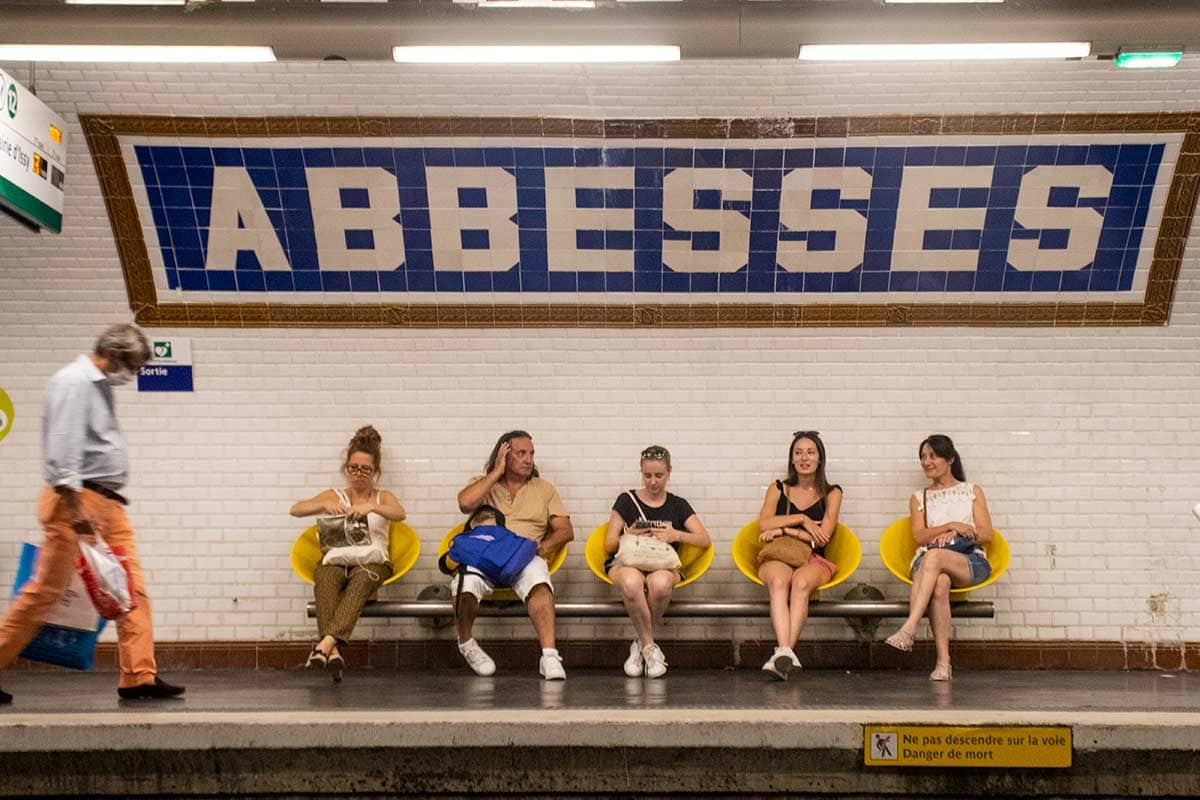 image of people on platform on abbesses metro station Montmartre Paris france